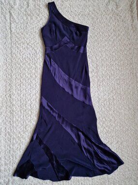A long evening dress made in the UK, in a violet color, with a full-length desig